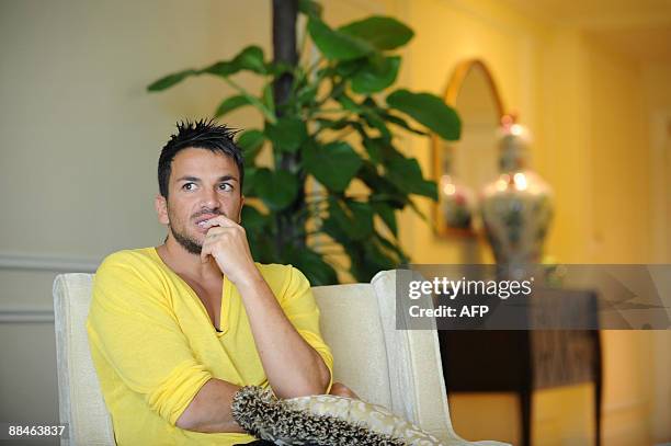 Singer and British TV personality Peter Andre talks to the media in his room at the Venetian Hotel on the third and final day of the 10th...