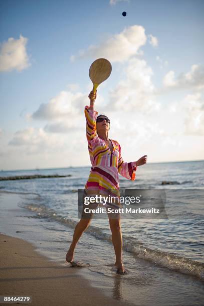 woman playing on the beach in cozumel, - paddle ball stock pictures, royalty-free photos & images