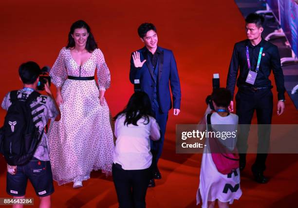This photo taken on December 2, 2017 shows swimmer Liu Xiang of China and former diver Tian Liang arriving for the 2017 FINA World Aquatics Gala in...