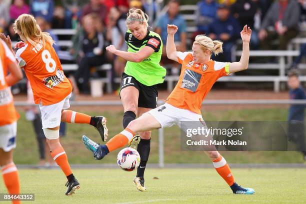 Elise Thorsnes of Canberra and Clare Polkinghorne of the Roar contest possession during the round six W-League match between Canberra United and the...