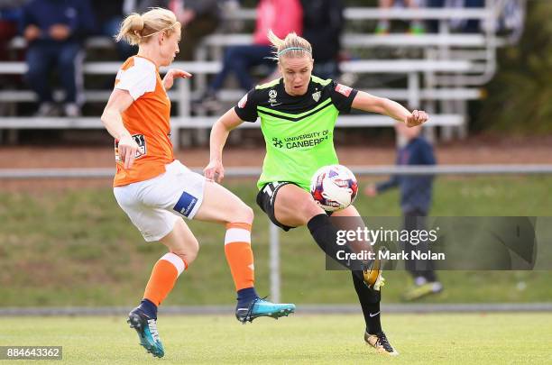 Elise Thorsnes of Canberra and Clare Polkinghorne of the Roar contest possession during the round six W-League match between Canberra United and the...