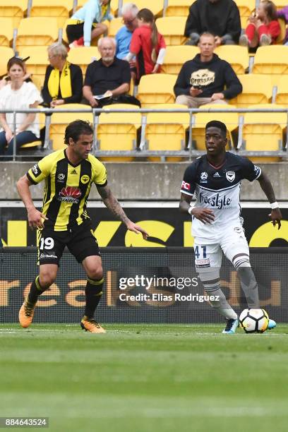 Thomas Doyle of the Wellington Phoenix marks Leroy George of Melbourne Victory during the round nine A-League match between the Wellington Phoenix...