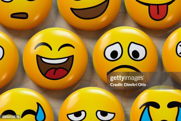 two emoji badges, one happy, one sad - smiley face foto e immagini stock