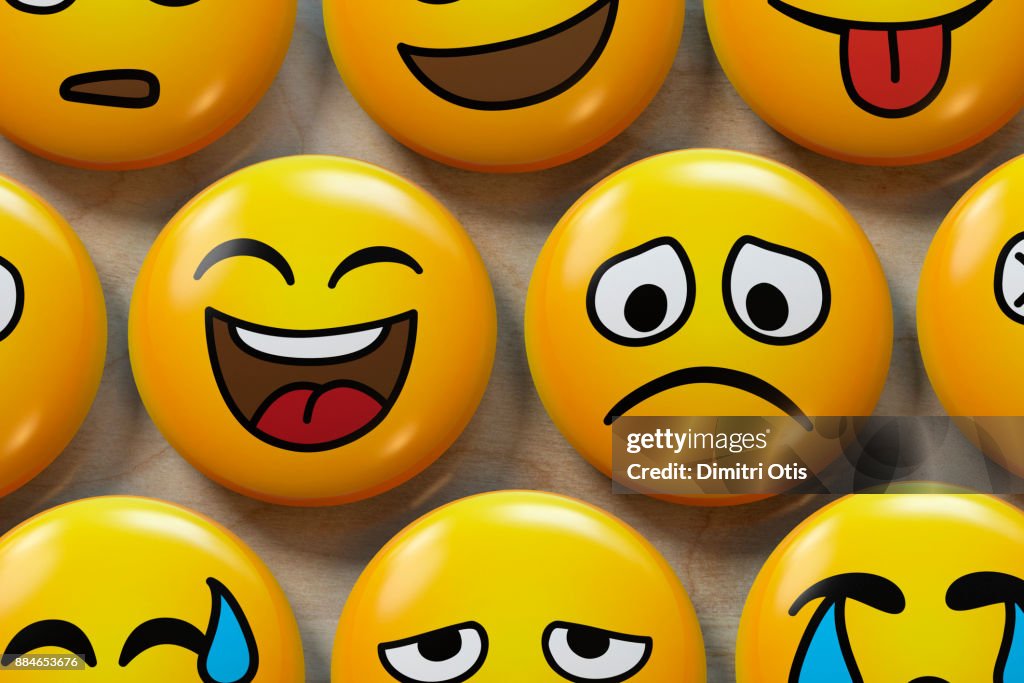 Two emoji badges, one happy, one sad