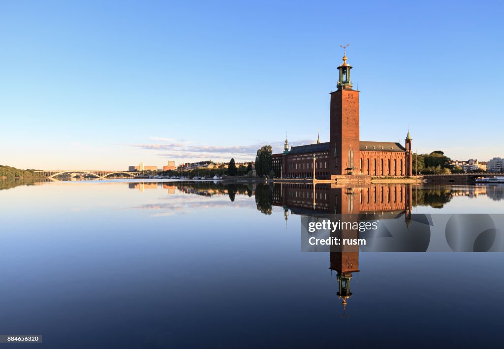 Stockholm City Hall with reflection on calm water