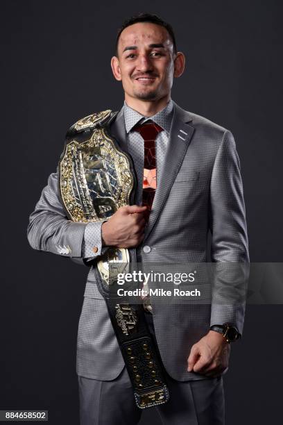 Featherweight champion Max Holloway poses for a post fight portrait backstage during the UFC 218 event inside Little Caesars Arena on December 02,...