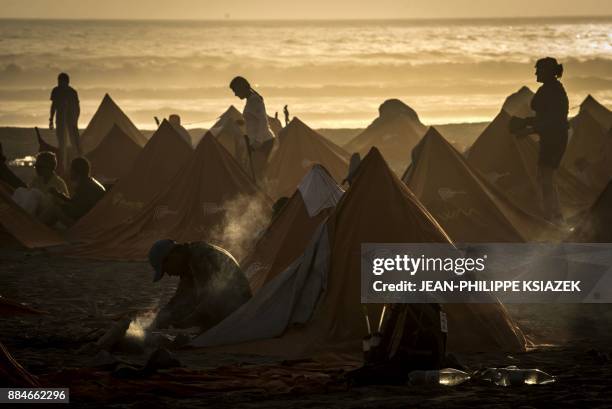 Competitors take part in the fourth stage during the first edition of the Marathon des Sables Peru between Ocucaje and Arloveto in the Ica desert, on...