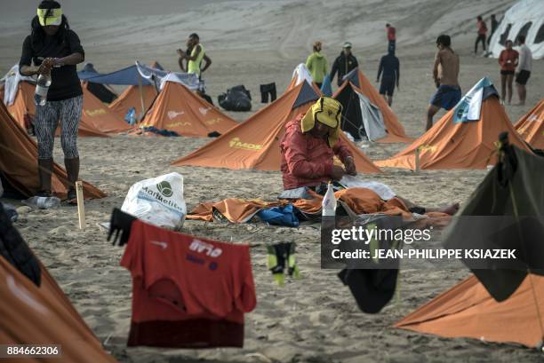 Competitors take part in the fourth stage during the first edition of the Marathon des Sables Peru between Ocucaje and Arloveto in the Ica desert, on...