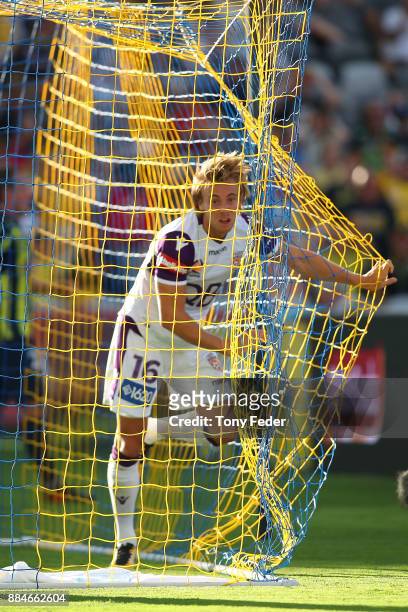 Joseph Mills of the Glory gets caught in the net during the round nine A-League match between the Central Coast Mariners and Perth Glory at Central...