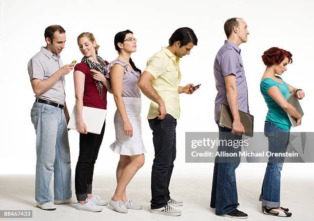 group of people waiting in line - gente en fila fotografías e imágenes de stock