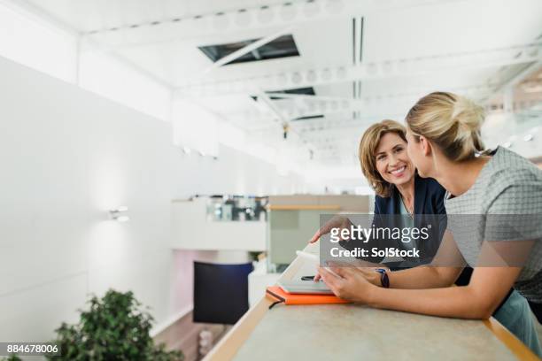 female professionals chatting - business relationship stock pictures, royalty-free photos & images