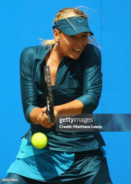 Maria Sharapova of Russia in action against Na Li of China during day Six of the AEGON Classic at the Edgbaston Priory Club on June 13, 2009 in...