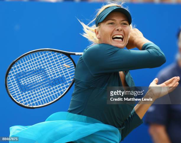 Maria Sharapova of Russia in action against Na Li of China during day Six of the AEGON Classic at the Edgbaston Priory Club on June 13, 2009 in...