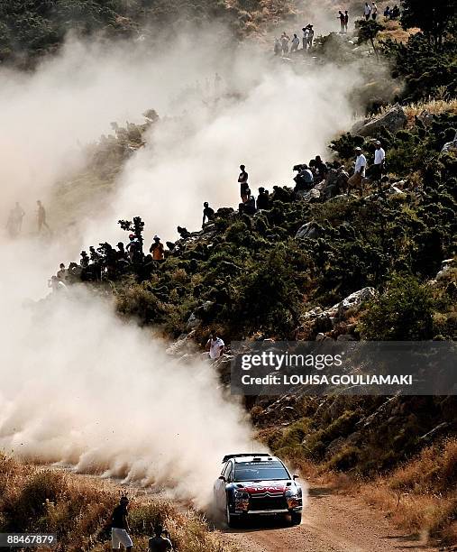 French Sebastien Loeb and Monaco's Daniel Elena drive their Citroen C4 at Klenia-Mycenae special stage on the day two of the WRC Rally Acropolis near...