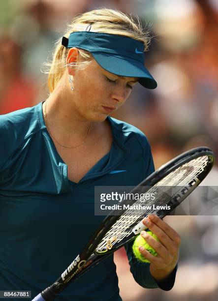 Maria Sharapova of Russia looks on during her match against Na Li of China during day Six of the AEGON Classic at the Edgbaston Priory Club on June...