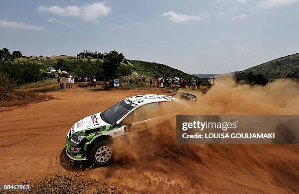 Britons Matthew Wilson and Scott Matrin drive their Ford Focus RS at Kefalari special stage on the day two of the WRC Rally Acropolis near the...