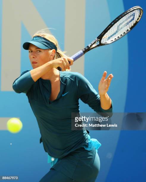 Maria Sharapova of Russia in action against Na Li of China during day Six of the AEGON Classic at the Edgbaston Priory Club on June 13, 2009 in...