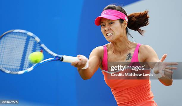 Na Li of China in action against Maria Sharapova of Russia during day Six of the AEGON Classic at the Edgbaston Priory Club on June 13, 2009 in...