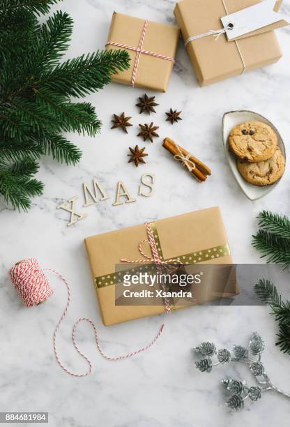 christmas gift boxes with winter themed decorations - yule marble stock pictures, royalty-free photos & images