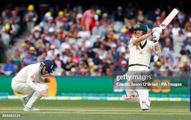 Australia's Pat Cummins hits a shot as Mark Stoneman ducks for cover during day two of the Ashes Test match at the Adelaide Oval, Adelaide.