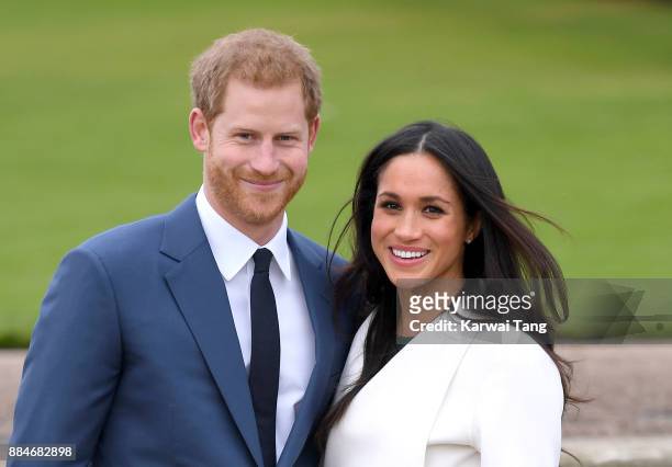 Prince Harry and Meghan Markle attend an official photocall to announce their engagement at The Sunken Gardens at Kensington Palace on November 27,...