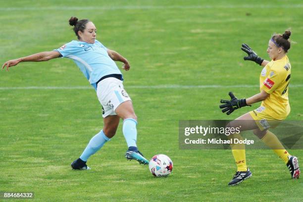 Kyah Simon of the City kicks the ball but misses a goal attempt against goalkeeper Sarah Willacy of United during the round six W-League match...