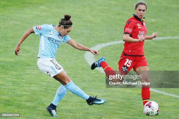 Kyah Simon of the City kicks the ball but misses a goal attempt next to Emma Checker of United during the round six W-League match between Melbourne...