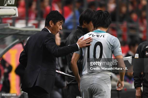 Head coach Masami Ihara of Avispa Fukuoka gives instruction to Hisashi Jogo during the J.League J1 Promotion Play-Off Final between Nagoya Grampus...