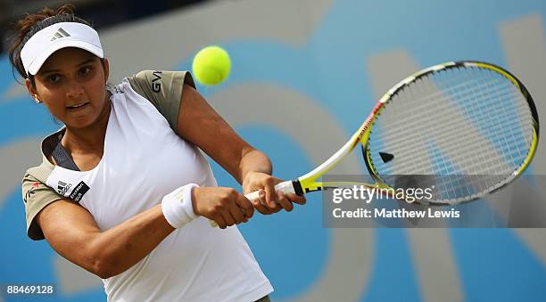 Sania Mirza of India in action against Magdalena Rybarikova of Slovakia during day Six of the AEGON Classic at the Edgbaston Priory Club on June 13,...