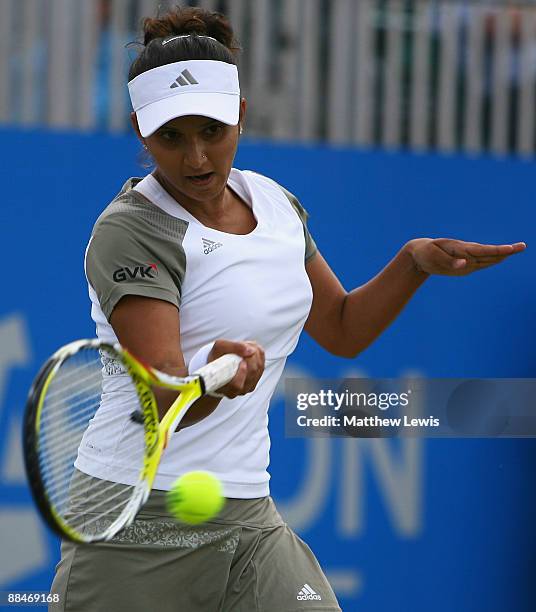 Sania Mirza of India in action against Magdalena Rybarikova of Slovakia during day Six of the AEGON Classic at the Edgbaston Priory Club on June 13,...