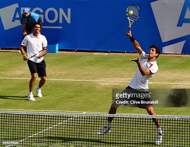 Marcelo Melo of Brazil plays a smash playing with Andre Sa of Brazil during the men's doubles semi final match against Jeff Coetzee of South Africa...