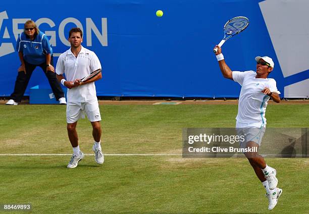 Jeff Coetzee of South Africa plays a smash playing with Jordan Kerr of Australia during the men's doubles semi final match against Andre Sa of Brazil...