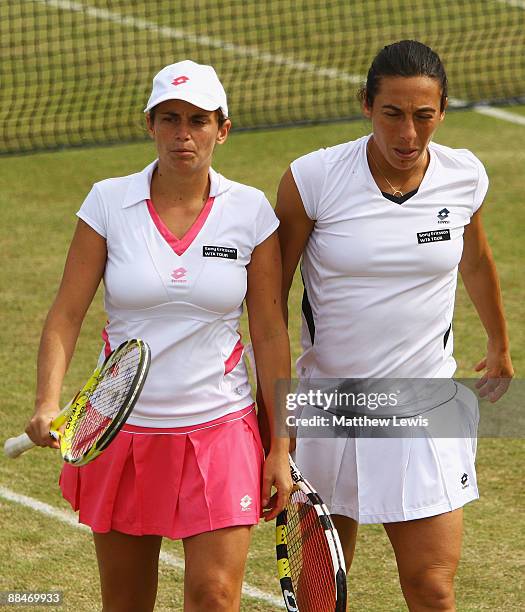 Francesca Schiavone and Roberta Vinci of Italy in action against Raquel Kops-Jones and Abigail Spears of the United States during day Six of the...