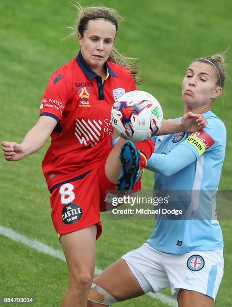 Emily Condon of United kicks the ball from Steph Catley of the City during the round six W-League match between Melbourne City and Adelaide United at...