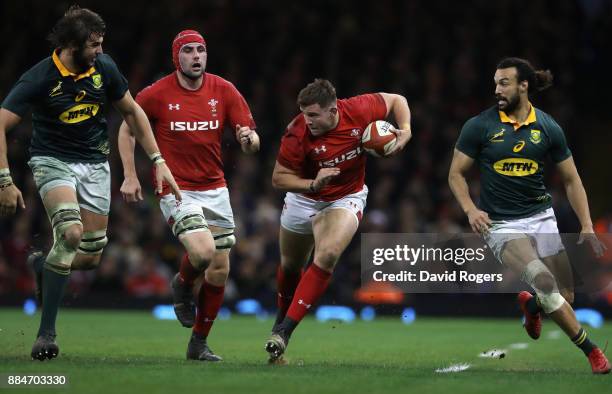 Elliot Dee of Wales takes on Lood de Jager and Dillyn Leyds during the rugby union international match between Wales and South Africa at the...