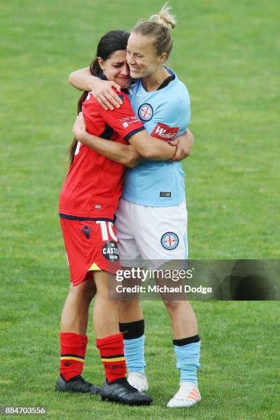 Alex Chidiac of United hugs friend Aivi Luik of the City after their draw during the round six W-League match between Melbourne City and Adelaide...