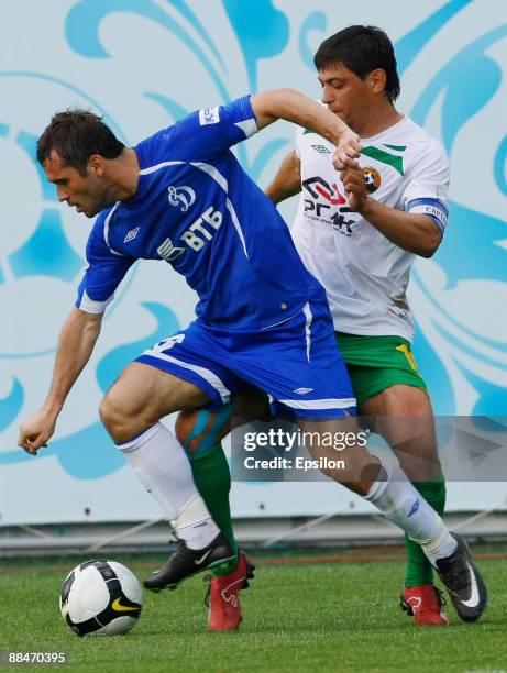 Aleksandr Kerzhakov of FC Dynamo Moscow battles for the ball with Andrei Topchu of FC Kuban Krasnodar during the Russian Football League Championship...