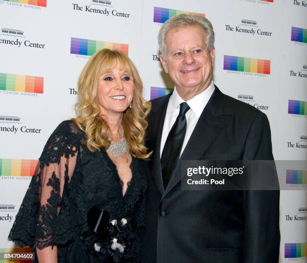 Natural gas billionaire Michael S Smith and his wife, Iris, arrive for the formal Artist's Dinner hosted by United States Secretary of State Rex...