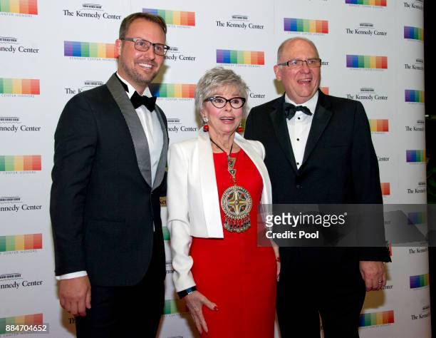 From left, Producer Brent Miller, 2015 Kennedy Center Honoree Rita Moreno, and manager John Ferguson arrive for the formal Artist's Dinner hosted by...