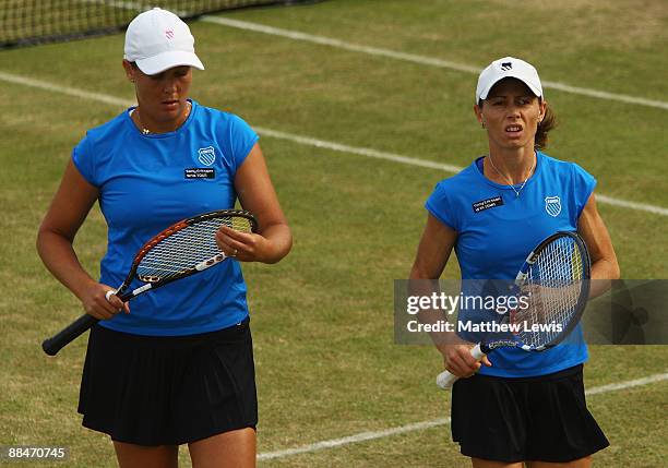 Liezel Huber of the United States and Cara Black of Zimbabwe in action against Sania Mirza of India and Chia-Jung Chuang of Taiwan during day Six of...