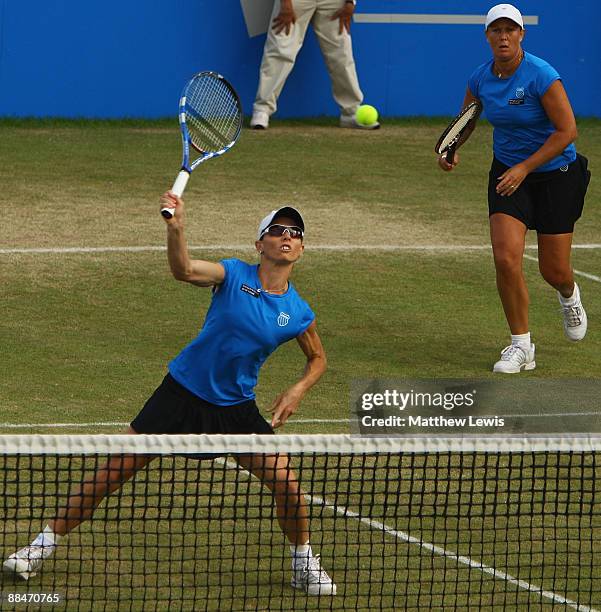 Cara Black of Zimbabwe and Liezel Huber of the United States in action against Sania Mirza of India and Chia-Jung Chuang of Taiwan during day Six of...