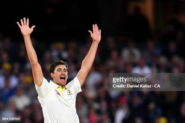 Mitchell Starc of Australia celebrates after taking the wicket of Mark Stoneman of England during day two of the Second Test match during the 2017/18...