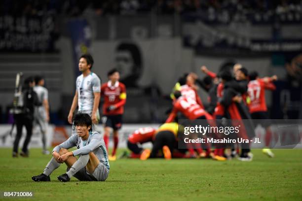 Takehiro Tomiyasu of Avispa Fukuoka shows dejection after the J.League J1 Promotion Play-Off Final between Nagoya Grampus and Avispa Fukuoka at...