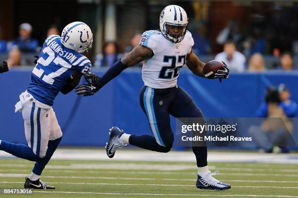 Derrick Henry of the Tennessee Titans breaks a tackle from Nate Hairston of the Indianapolis Colts at Lucas Oil Stadium on November 26, 2017 in...