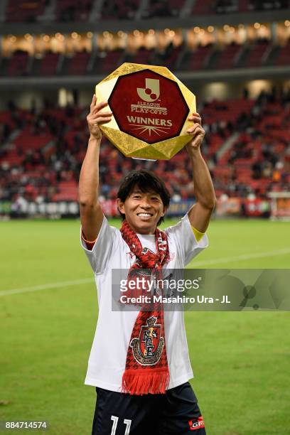 Captain Hisato Sato of Nagoya Grampus applauds suppoorters as he celebrates the promotion to the J1 after the J.League J1 Promotion Play-Off Final...