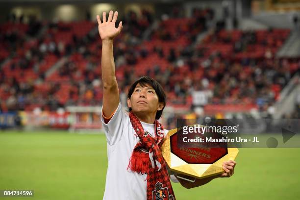 Captain Hisato Sato of Nagoya Grampus applauds suppoorters as he celebrates the promotion to the J1 after the J.League J1 Promotion Play-Off Final...