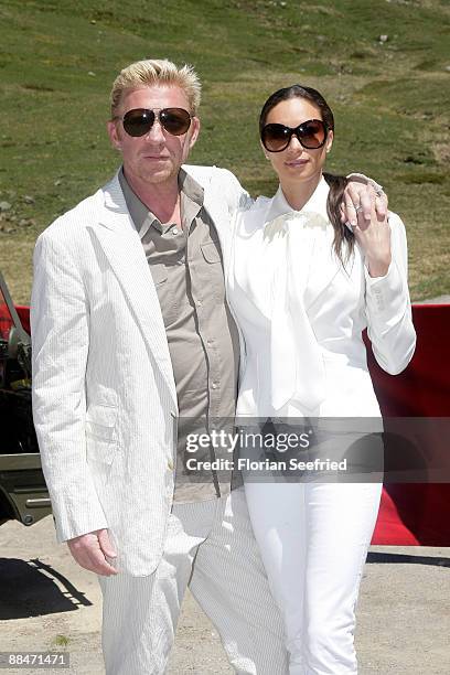 Former tennis star Boris Becker and his wife Sharlely pose for a picture after taking a ski lift to their wedding brunch reception, on June 13, 2009...