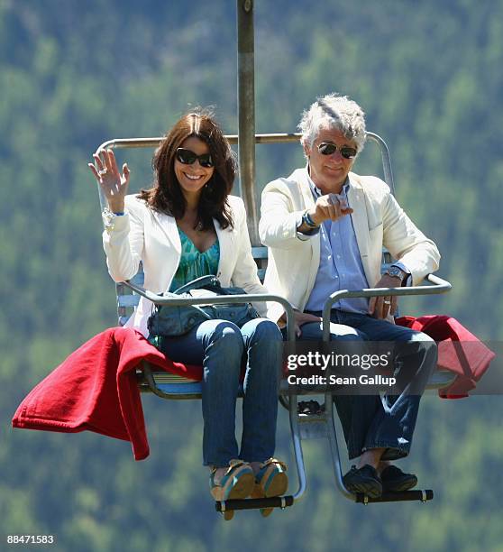 Sports television presenter Marcel Reif and his partner Marion Kiechle ride a ski lift to the wedding brunch reception of former tennis star Boris...