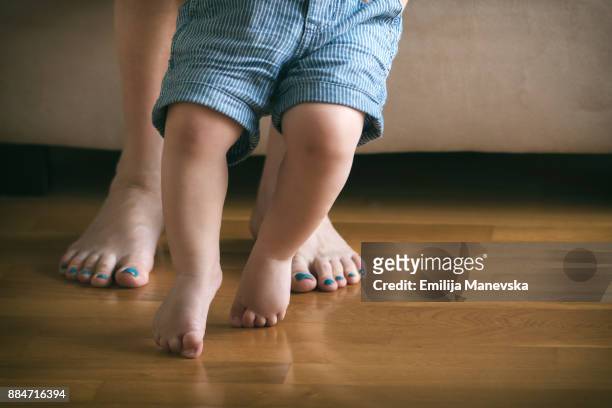 baby first steps - little feet stock pictures, royalty-free photos & images