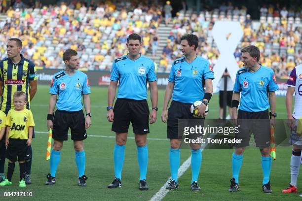 Referees line up before the start of the match L-R James Tesoriero Shaun Evans Kris Griffith-Jones and Lance Greenshields during the round nine...